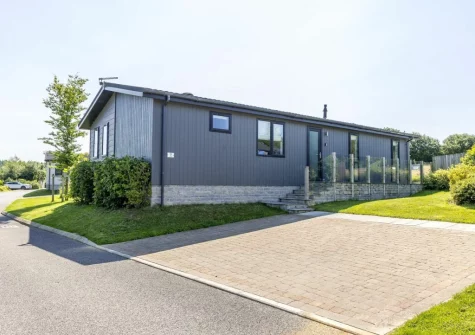 Poppy, 5 Roadford Lakes Lodges is a stylish two-bedroom holiday home with lovely views over open fields, offering a fantastic balance of indoor comfort & outdoor living