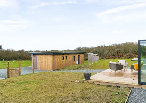 The decked patio, outdoor sitting area & garden at Poppyfields at Tremorvu Lodges, Ashton