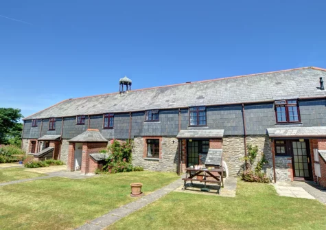 The patio, alfresco dining area & large shared garden at Porghelly Cottage, Harlyn