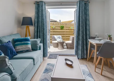 Portbeck, Porthleven is a stylish, pet-friendly cottage offering a luxurious seaside retreat for couples. Enjoy contemporary comforts, a private courtyard, and direct access to stunning coastal walks and South Cornwall's finest attractions.
