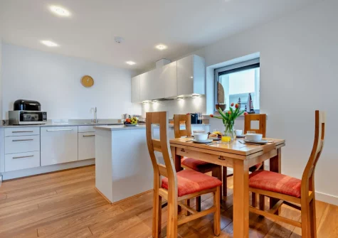The kitchen & dining area at Porth Apartment, Newquay