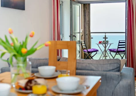 The balcony & outdoor sitting area at Porth Apartment, Newquay