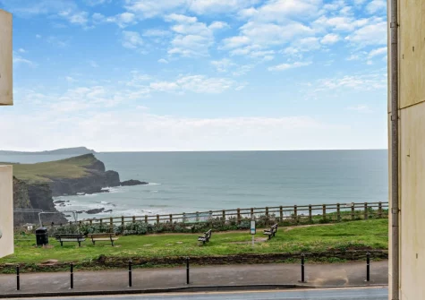 The sea view from the balcony & outdoor sitting area at Porth Apartment, Newquay