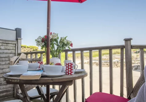 The balcony & outdoor sitting area at Porth Beach House at Mermaid Court, Newquay