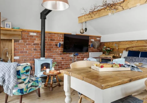 The living & dining area at Porth Chapel at the Buryas Bridge Collection, Buryas Bridge