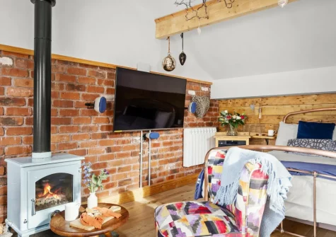 The living & sleeping area at Porth Chapel at the Buryas Bridge Collection, Buryas Bridge