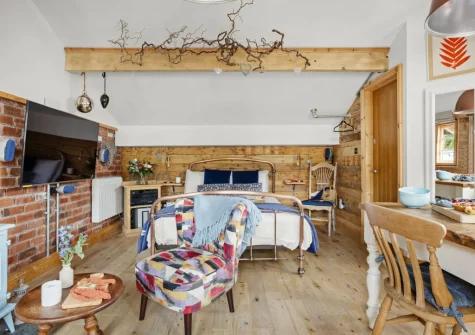 The living & sleeping area at Porth Chapel at the Buryas Bridge Collection, Buryas Bridge