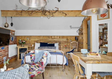 The living, dining & sleeping area at Porth Chapel at the Buryas Bridge Collection, Buryas Bridge
