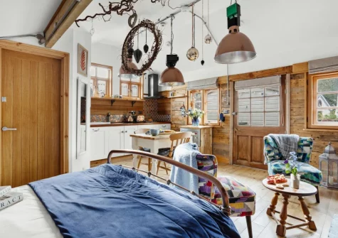 The sleeping & living area at Porth Chapel at the Buryas Bridge Collection, Buryas Bridge