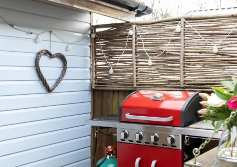The decked terrace & barbecue area at Porth Chapel at the Buryas Bridge Collection, Buryas Bridge