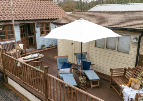 The decked terrace, alfresco dining & outdoor sitting area at Porth Chapel at the Buryas Bridge Collection, Buryas Bridge