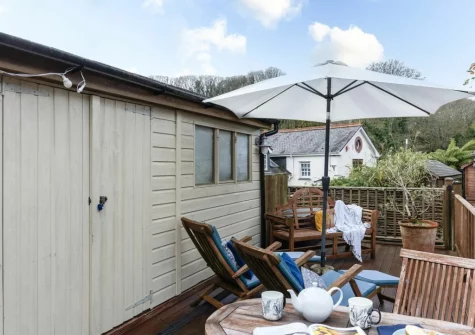 The decked terrace, alfresco dining & outdoor sitting area at Porth Chapel at the Buryas Bridge Collection, Buryas Bridge