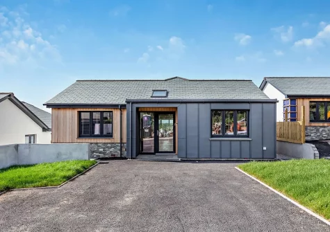 Portside is an elegant five-bedroom home with a balcony that offers expansive sea views
