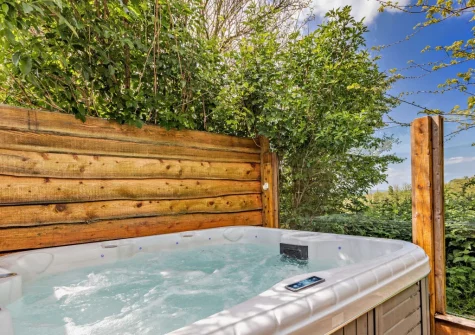 The decked patio & hot tub at Potbelly, Westward Ho!