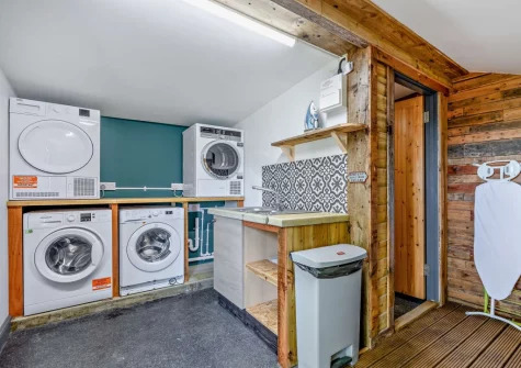 The communal laundry room with washing machine, tumble dryer and drying facilities at Potbelly, Westward Ho!
