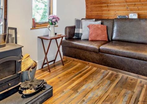 Potbelly, Westward Ho! is a distinctive cedar pod with curved wooden walls set within a pub's peaceful grounds, featuring a private hot tub, cosy woodburner, contemporary interiors, and Westward Ho!'s spectacular sandy beach less than a mile away.