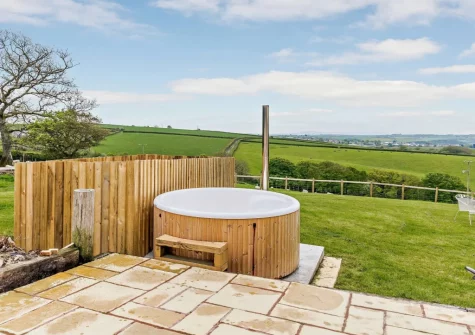 The wood-fired hot tub & enclosed garden at Priestacott Tithe Barn, Torrington