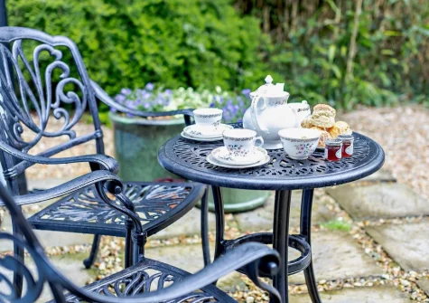 The patio & outdoor sitting area at Primrose Cottage at Greatrock Farm, Hennock