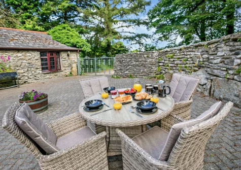 The patio & alfresco dining area at Primrose Cottage, Camelford