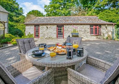 The patio & alfresco dining area at Primrose Cottage, Camelford