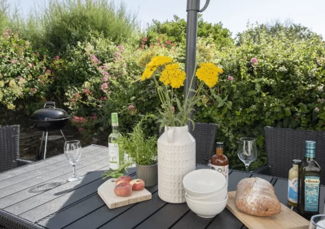 The terrace, barbecue & alfresco dining area at Primrose Cottage, Treyarnon
