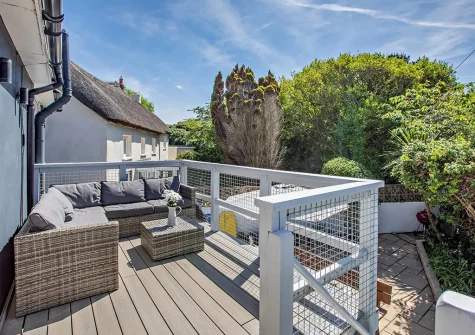 The decked balcony & outdoor sitting area at Priory Stables, Croyde