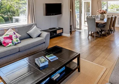 Priory Stables, Croyde is a stunning 4-bedroom detached home in the heart of the surfing village. Enjoy a sun deck with village views, enclosed garden with BBQ facilities, and walking distance to golden beach, pubs and shops for holidays.
