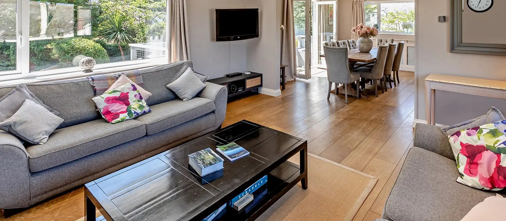 Priory Stables, Croyde is a stunning 4-bedroom detached home in the heart of the surfing village. Enjoy a sun deck with village views, enclosed garden with BBQ facilities, and walking distance to golden beach, pubs and shops for holidays.