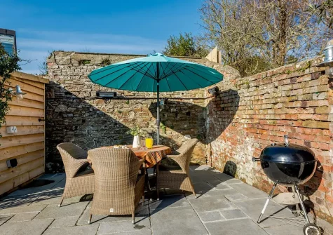 The patio, barbecue & alfresco dining area at Prospect House, Appledore