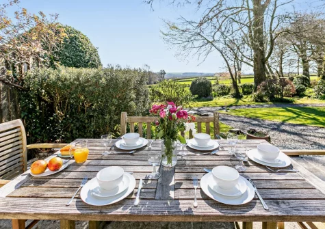 The patio & alfresco dining area at Pyworthy Cottage, North Tamerton