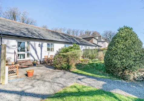 Pyworthy Cottage is two-bedroom cottage set within the leafy gardens of a former rectory