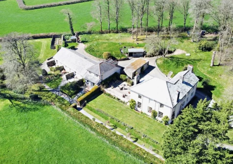 Pyworthy Cottage is two-bedroom cottage set within the leafy gardens of a former rectory