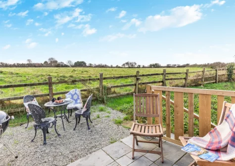 The elevated terrace, barbecue & alfresco dining area at Quarry Cottage, Veryan