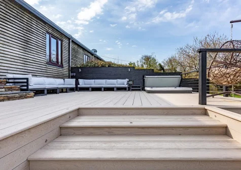 The decked patio, outdoor sitting area & hot tub at Quay West, Lee