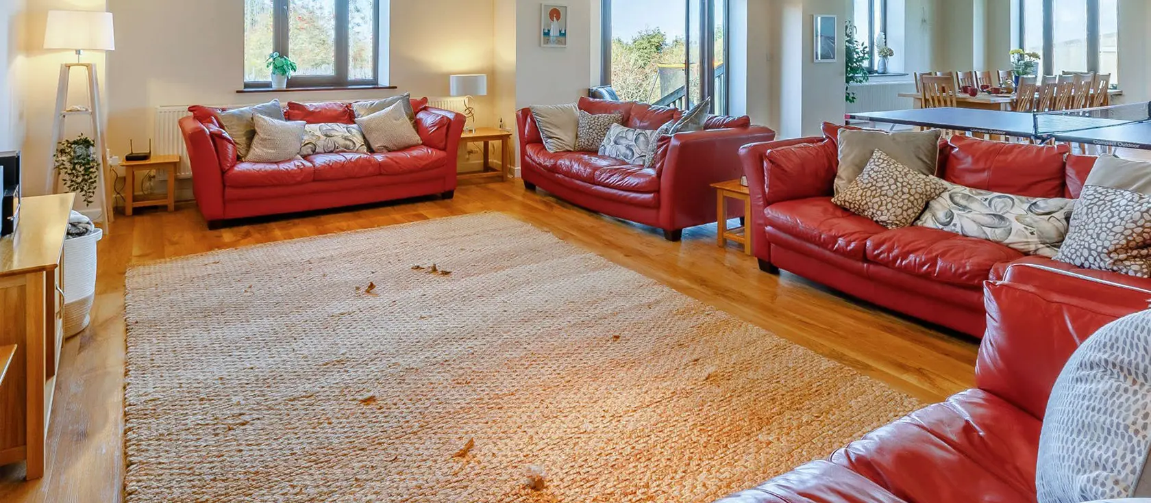 Quay West, Lee is a stunning single-level retreat with countryside-to-sea views, featuring spacious open-plan living, five bedrooms, outdoor entertainment areas with hot tub, and near to world-class beaches. Perfect for unforgettable family breaks.