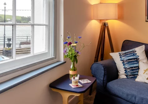 Quayside Corner, Appledore is a charming Grade II-listed 18th-century cottage in the heart of this captivating estuary village, featuring a unique upside-down layout with first-floor lounge offering stunning water views and direct quayside access.