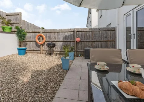 The patio, barbecue & alfresco dining area at Queens Retreat, Westward Ho!