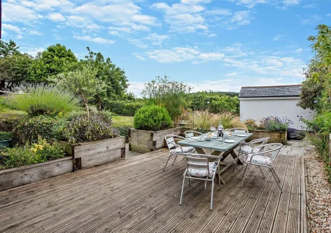 The decked terrace, alfresco dining area & garden at Quintin Cottage, Landkey