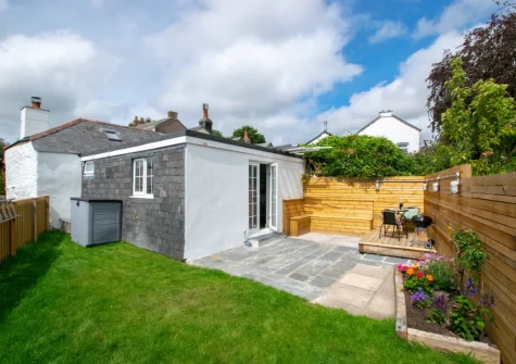 The patio, barbecue, alfresco dining area & enclosed lawned garden at Radfords Cottage, Egloshayle