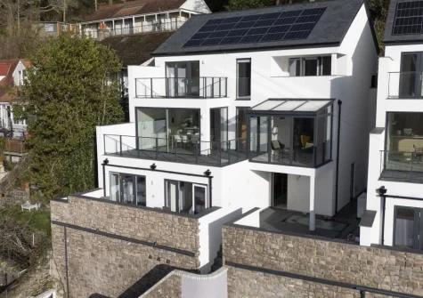 Redshank is a stunning, multi-level coastal house with sweeping estuary views, private balconies, a fantastic cinema room and elevated living spaces