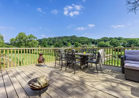 The decked patio, alfresco dining & outdoor sitting area at Ridd Cottage, Weare Giffard