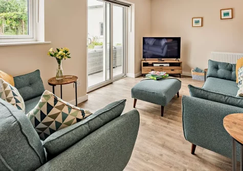 Ridgeway, Westward Ho! is a stylish single-storey holiday home just 50 metres from golden sandy beaches. With three spacious bedrooms, enclosed garden, and family entertainment including garage games, it's perfect for unforgettable seaside holidays.