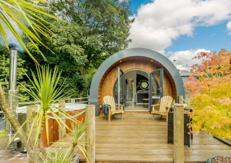 The terrace, outdoor sitting, alfresco dining area & hot tub at River Avon Retreat, Avonwick