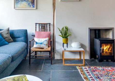 River Cottage, Polruan is a beautifully refurbished one-bedroom retreat overlooking the River Fowey, featuring Danish-style interiors, a cosy wood-burner, and stunning estuary views, with beach, pubs, and the Fowey passenger ferry just steps away.
