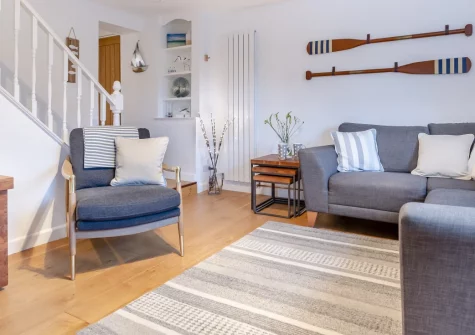 River Watch, Fowey is a charming cottage in the heart of this historic harbour town, offering scenic river views from its elevated living room and private terrace, contemporary interiors, and the rare advantage of off-street parking.