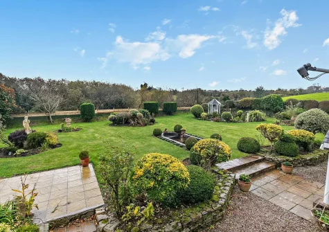 The beautifully manicured garden at Riverbank Rose, Relubbus
