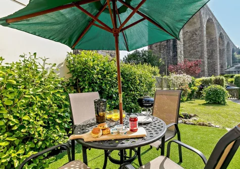Admire the historic viaduct from the garden when you stay at Riverside Cottage, Angarrack