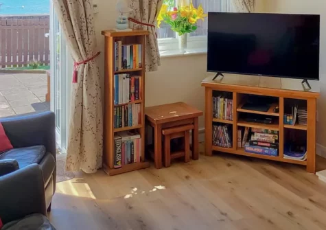 Riverside Mews, Bideford is a charming cottage right beside the South West Coast Path, boasting stunning River Torridge views from an enclosed garden, contemporary interiors, and direct access to coastal walks and the Tarka Trail.