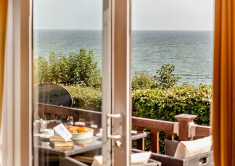 Step out onto the decked terrace with alfresco dining area at Riviera Bay, Brixham