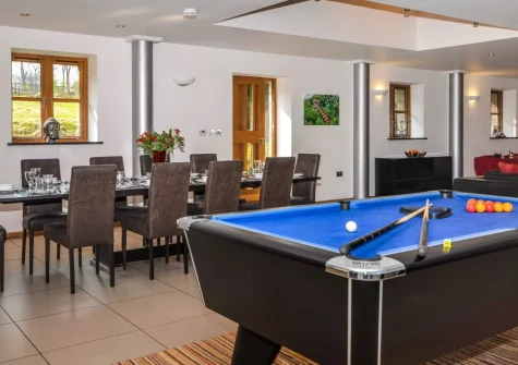 The dining area & pool table at Rock Barn, South Tawton